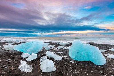 Scenic view of sea against sky during winter