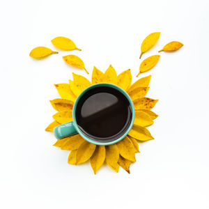 Directly above shot of coffee cup against white background