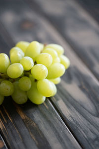 Close-up of green grapes on table