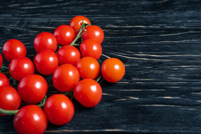 High angle view of cherry tomatoes on table