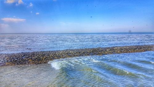 Scenic view of beach against sky