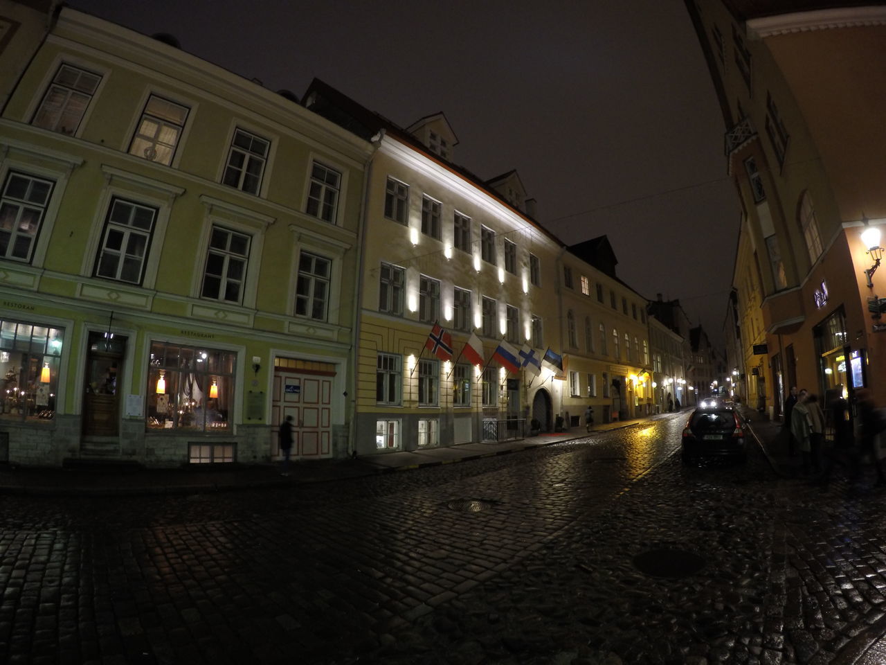 architecture, built structure, illuminated, building exterior, night, street, city, transportation, street light, incidental people, car, lighting equipment, city life, city street, building, the way forward, sky, outdoors, road, mode of transport