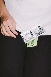 Close-up of woman hand with text