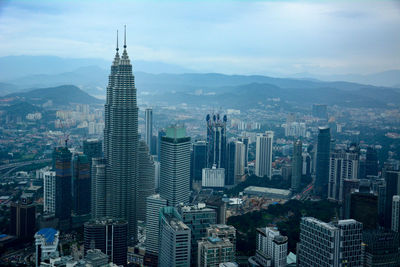 Aerial view of cityscape against sky