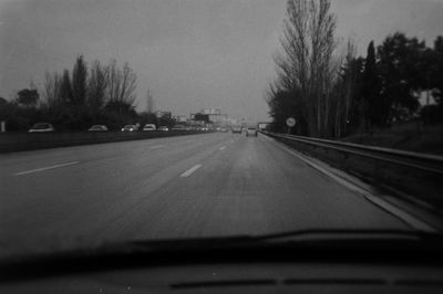 Road seen through car windshield