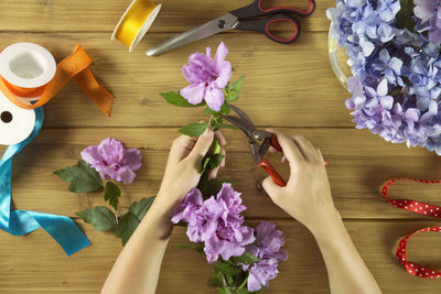 Close-up of purple flowers on wooden table