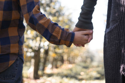 Close-up of couple holding hands