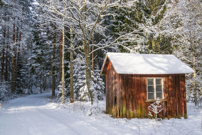 House on snow covered field