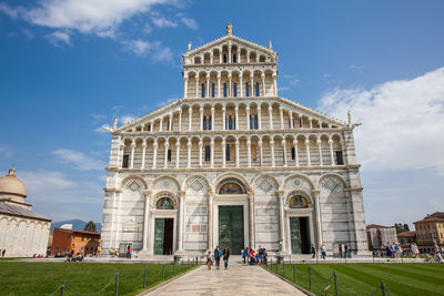 Tourists at the primatial metropolitan cathedral of the assumption of mary in pisa