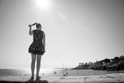 Silhouette of woman standing on beach