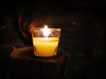 Close-up of illuminated tea light candle