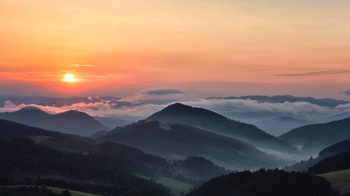 Scenic view of mountains against sky during sunset