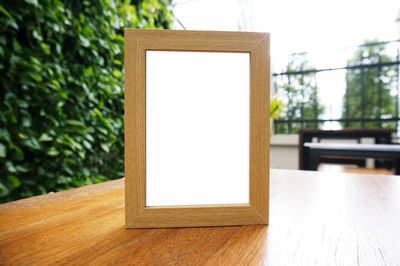 Close-up of blank placard on table at sidewalk cafe