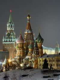 Illuminated cathedral against sky during winter at night