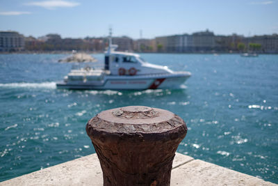 Close-up of bollard at port