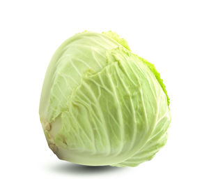 Close-up of lemon slice over white background