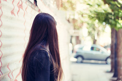 Rear view of woman standing outdoors