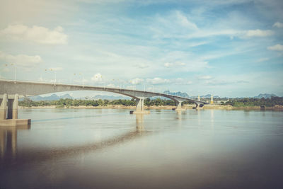 Bridge over river against sky