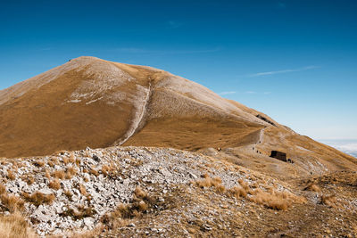 Scenic view of mountain against sky in arquata del tronto, marche italy