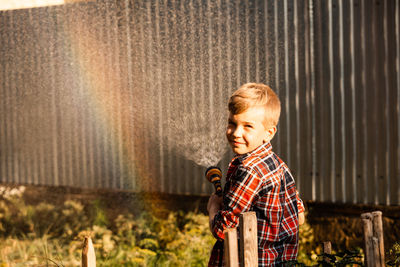 Portrait of boy standing outdoors