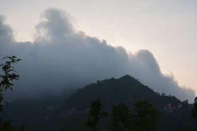 Scenic view of tree mountains against sky