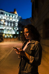 Man using mobile phone in city