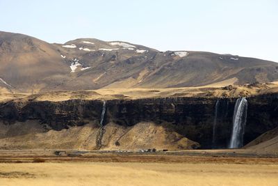 Scenic view of mountains against clear sky