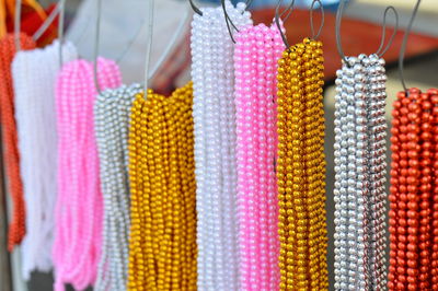 Close-up of pearl necklaces for sale at market stall