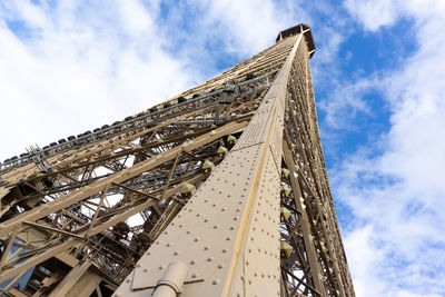 Low angle view of crane against sky