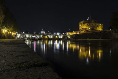 Illuminated buildings at waterfront