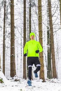 Man with umbrella in forest