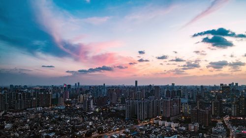 High angle view of city at sunset