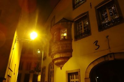 Low angle view of illuminated building at night