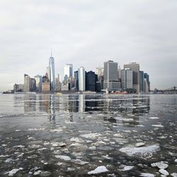 City by sea against sky during winter