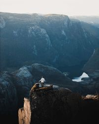 Distant view of person standing on mountain