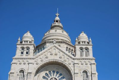 Low angle view of a building against blue sky