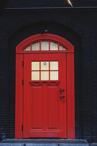 Closed red door of building