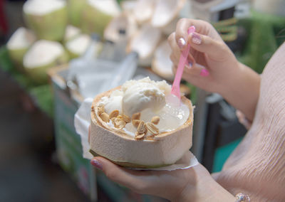 Midsection of person holding ice cream