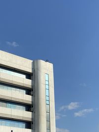 Low angle view of building against clear blue sky