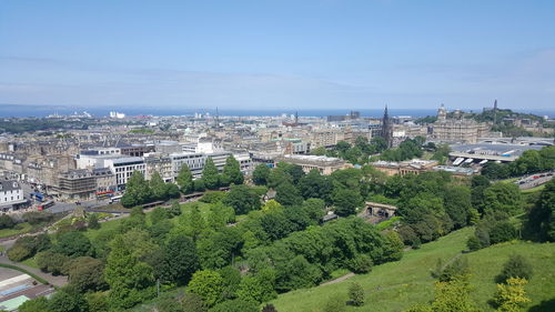 High angle view of cityscape against blue sky