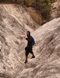 High angle view of young man on rock