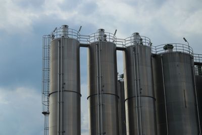 Low angle view of smoke stack against sky