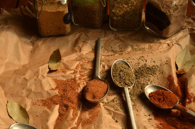 High angle view of spices on brown paper