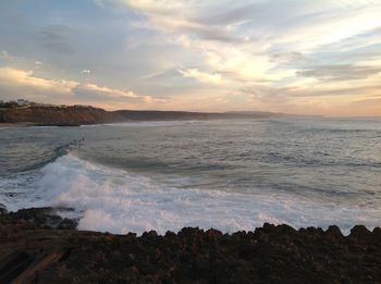 Scenic view of sea against dramatic sky