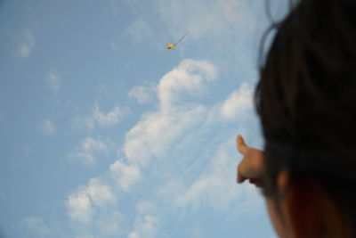 Low angle view of airplane flying in sky