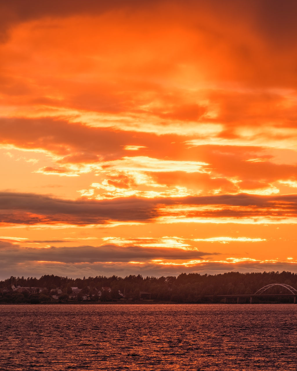 sky, cloud, sunset, water, beauty in nature, scenics - nature, nature, environment, dramatic sky, sea, tranquility, afterglow, landscape, orange color, horizon, tranquil scene, no people, sunlight, red sky at morning, travel destinations, outdoors, land, cloudscape, idyllic, travel, sun, dusk, moody sky, evening, tourism, mountain, seascape, atmospheric mood, urban skyline, holiday, summer, trip, vacation, vibrant color, red