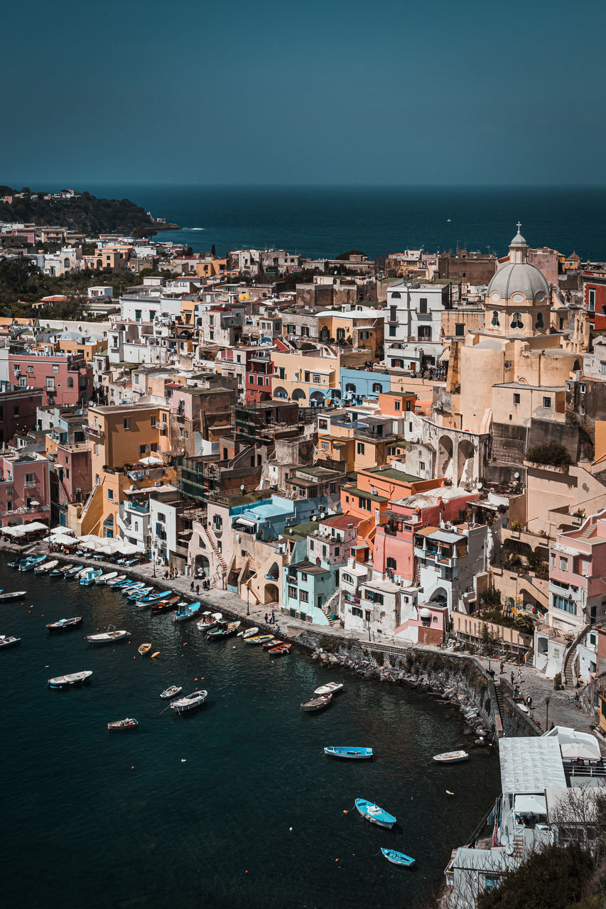 Aerial view of townscape by sea