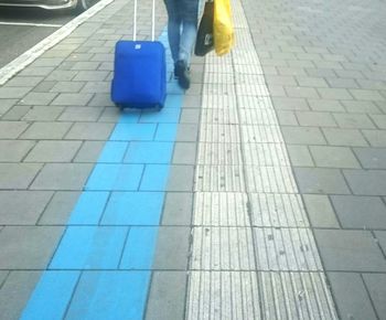 Low section of people on tiled floor