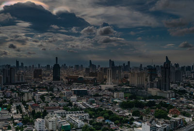 High angle view of city buildings at sunset