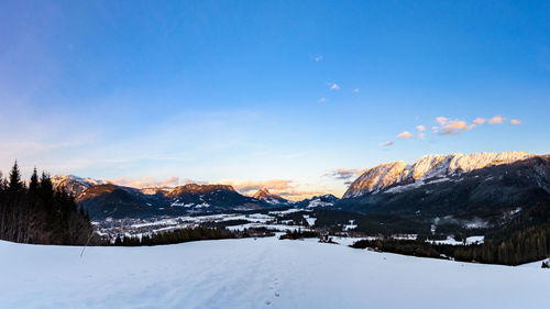 Scenic view of snow covered mountains against sky